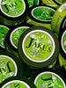 Multiple tins of Jake's Mint Chew Natural Spearmint Pouches – an all-natural, tobacco-free, and nicotine-free alternative to chewing tobacco.